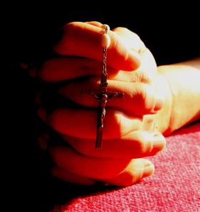 rosary in hand_red